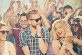 Big group of people dancing and having a good time at music festival