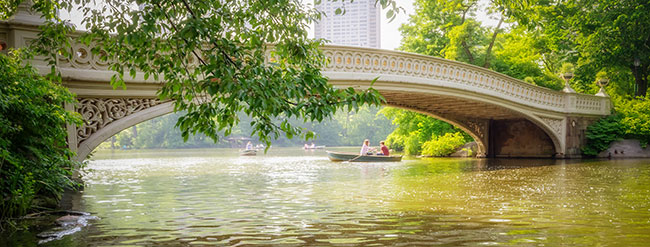 Central Park Bridge with people in a boat