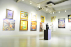 art exhibit with paintings on the wall