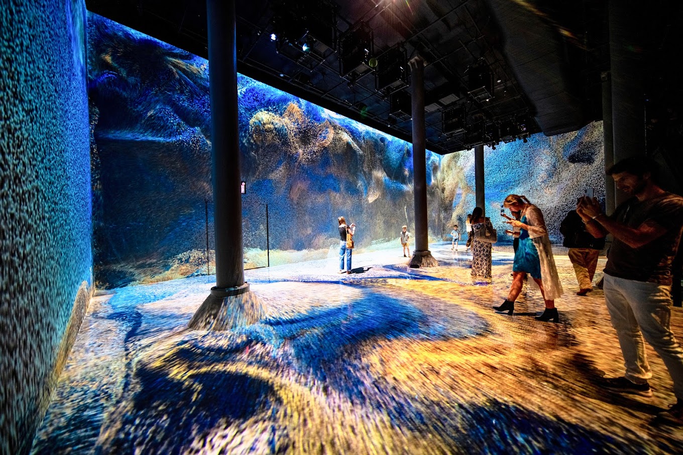 people in immersive art exhibit